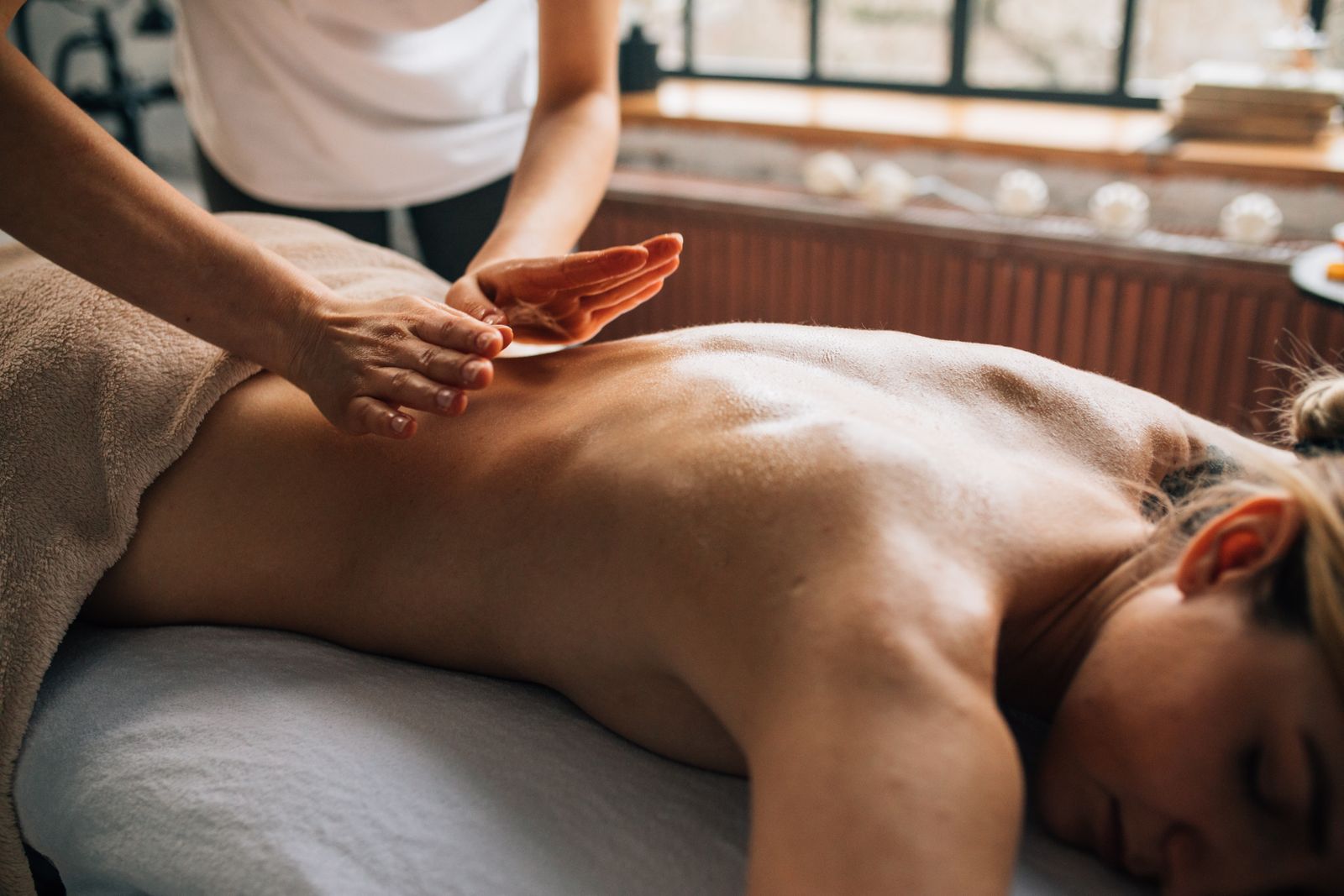 A serene massage therapy session indoors focusing on relaxation and self-care.