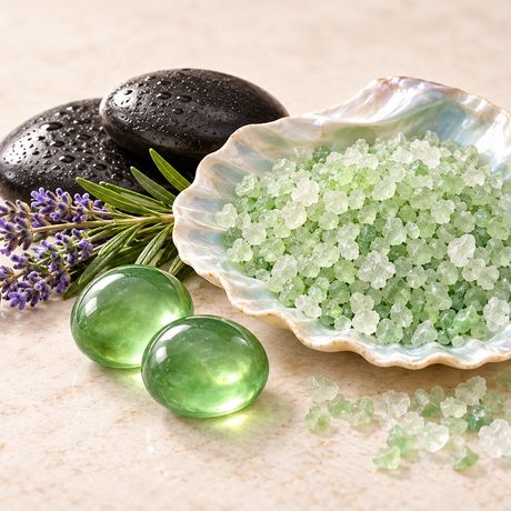 Warm stones and green mineral salts in a pearl shell
